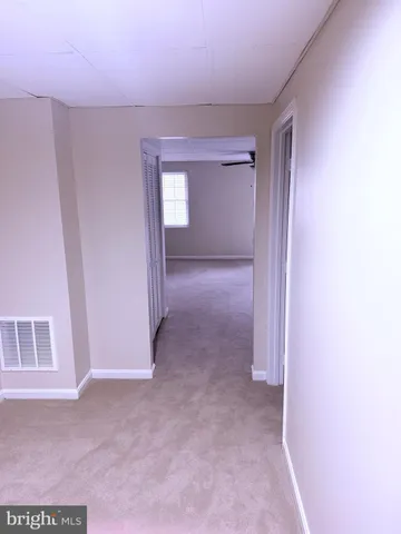a bathroom with a sink mirror and toilet