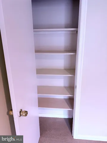 a view of a lounge chair in the back of a house