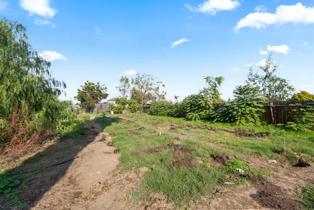 a view of a town with mountains in the background