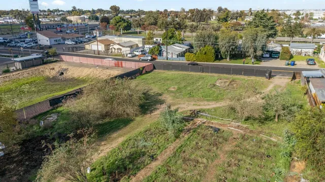 an aerial view of residential houses and outdoor space