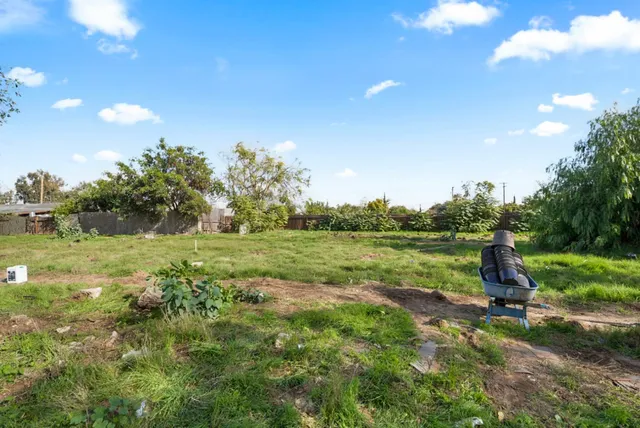 a view of a lake with a yard