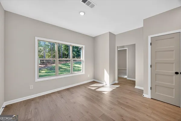 a view of an empty room with a window