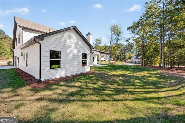 a aerial view of a house with a yard patio and slide