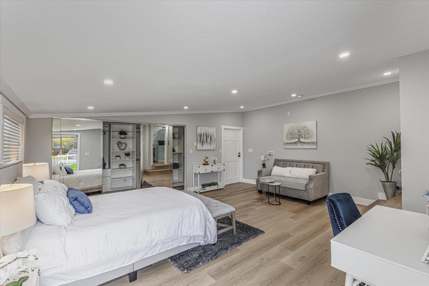 2797 Cornwall Drive San Jose, CA 95127 - Photo 14 of 24 a spacious bedroom with a bed a couch and a potted plant