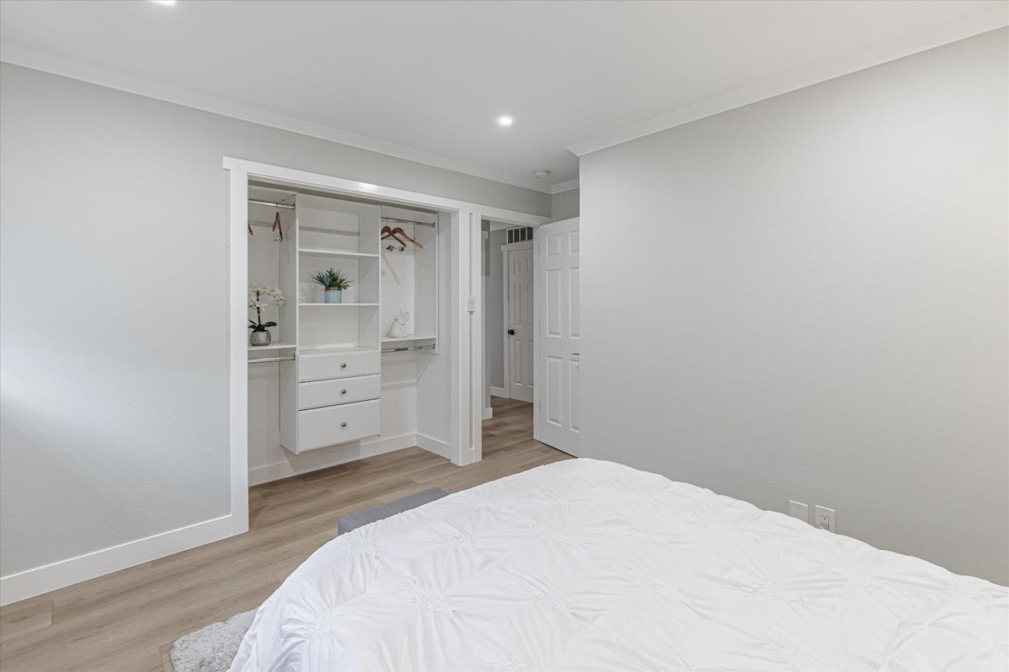 2797 Cornwall Drive San Jose, CA 95127 - Photo 16 of 24 a bedroom with a bed and cabinets
