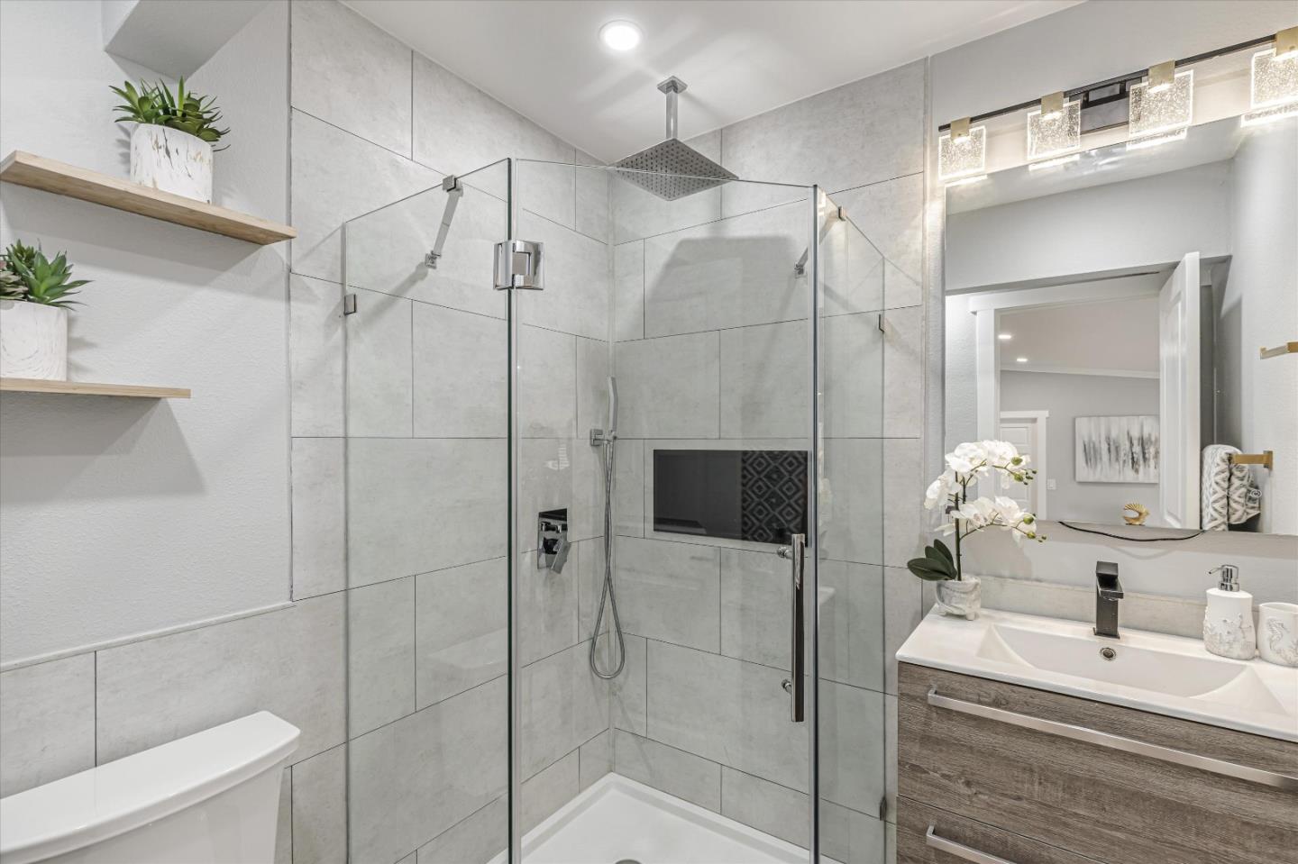 2797 Cornwall Drive San Jose, CA 95127 - Photo 17 of 24 a bathroom with a shower a sink and mirror