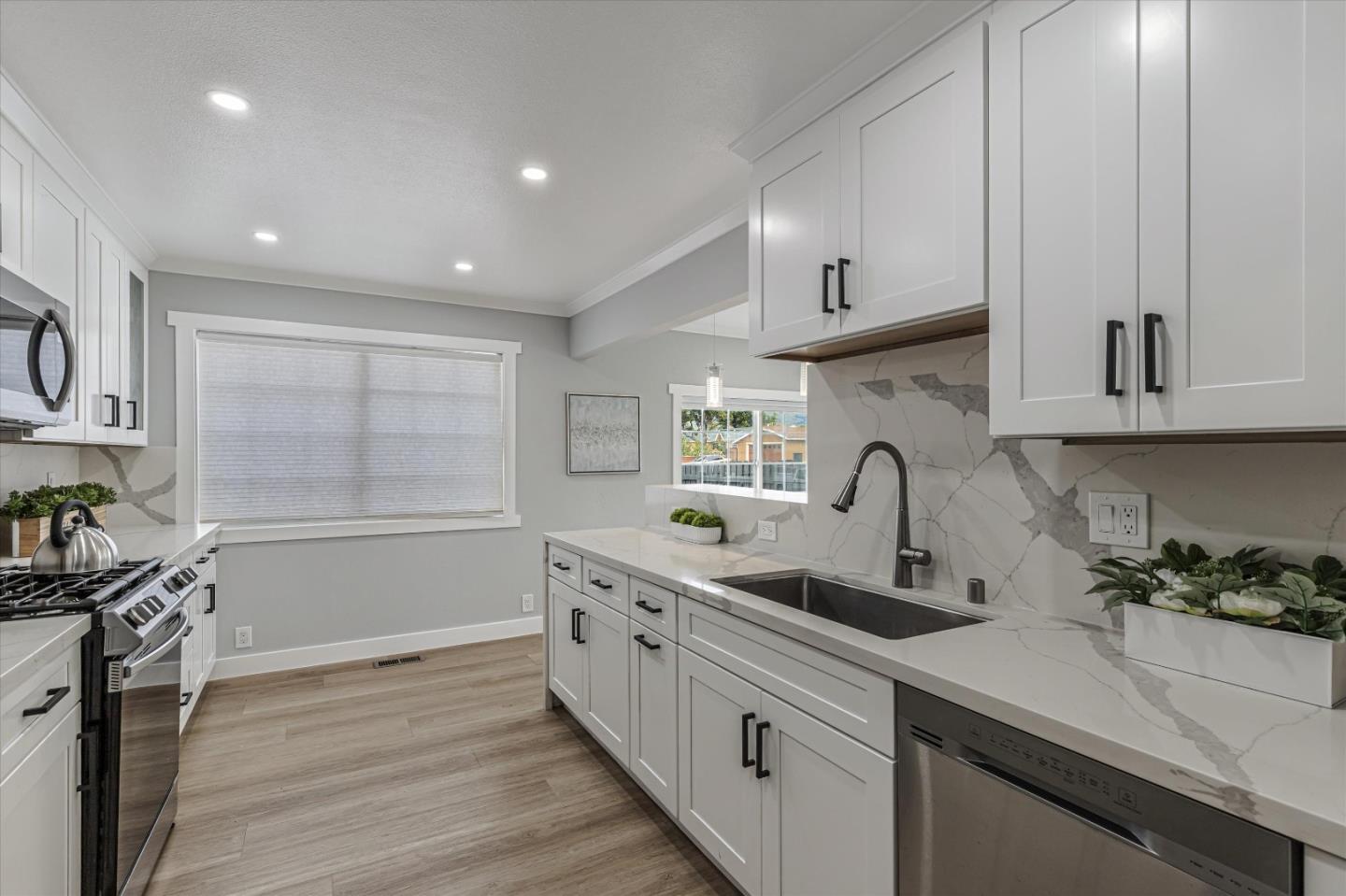 2797 Cornwall Drive San Jose, CA 95127 - Photo 7 of 24 a kitchen with stainless steel appliances a sink stove and cabinets