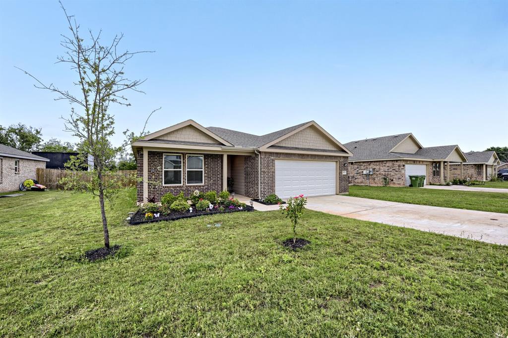 420 Jameson Springtown, TX 76082 - Photo 2 of 29 a front view of a house with a yard and porch