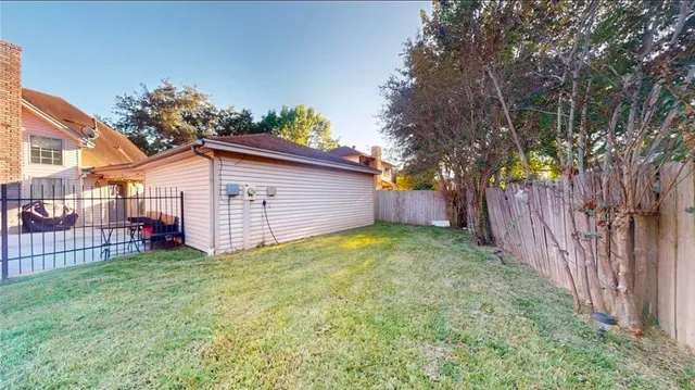 a view of a chair and tables in the house