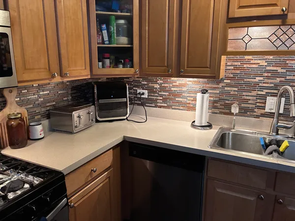a kitchen with a sink and cabinets