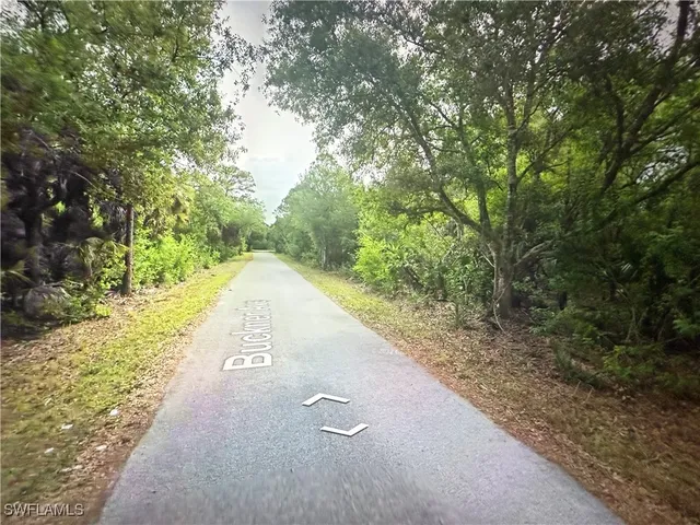 a view of a street with a trees