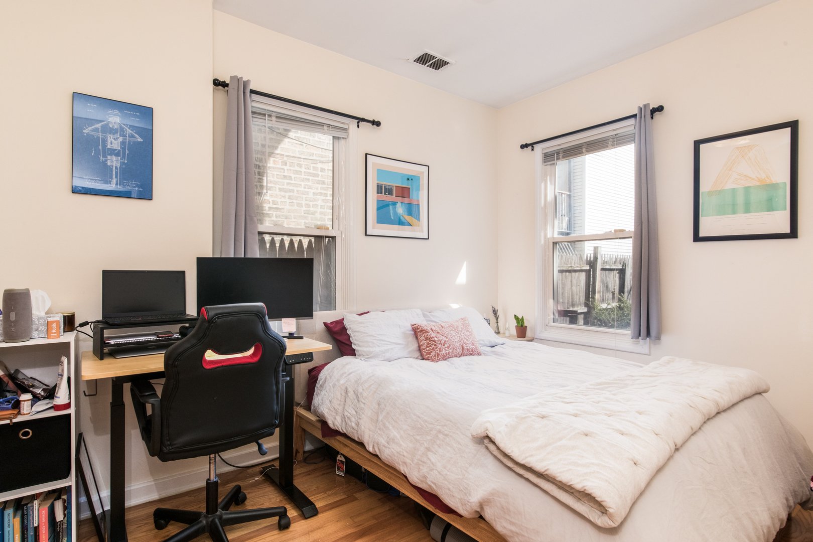 1249 North Cleaver Street, Unit G Chicago, IL 60642 - Photo 11 of 21 a bedroom with a bed window and a desk