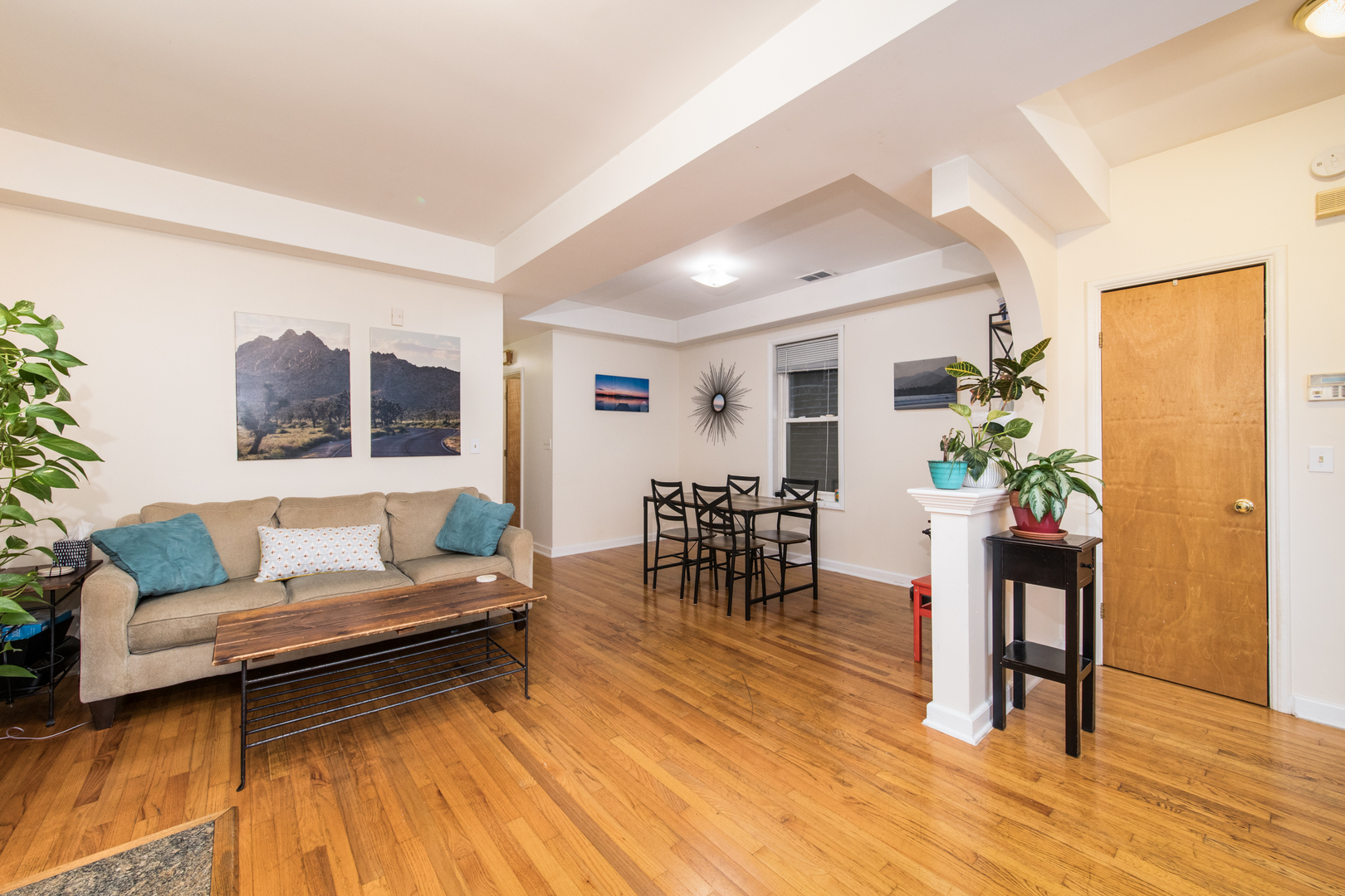 1249 North Cleaver Street, Unit G Chicago, IL 60642 - Photo 4 of 21 a living room with furniture and a wooden floor