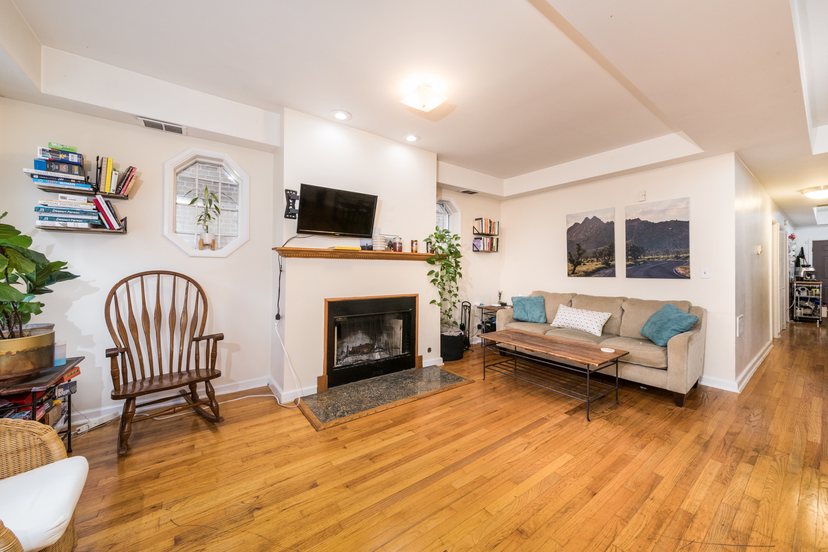 1249 North Cleaver Street, Unit G Chicago, IL 60642 - Photo 6 of 21 a living room with furniture and a fireplace
