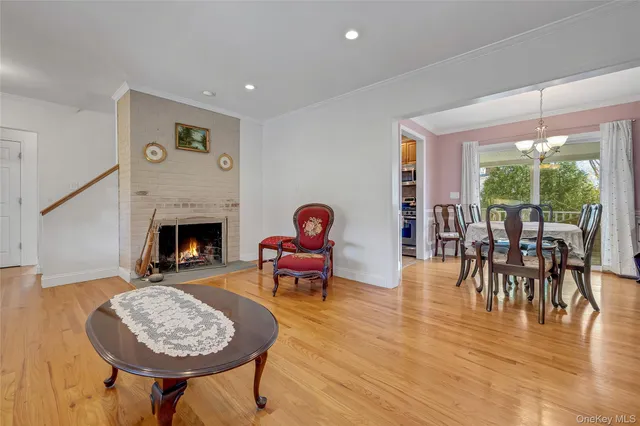 a view of a dining room with furniture wooden floor and chandelier