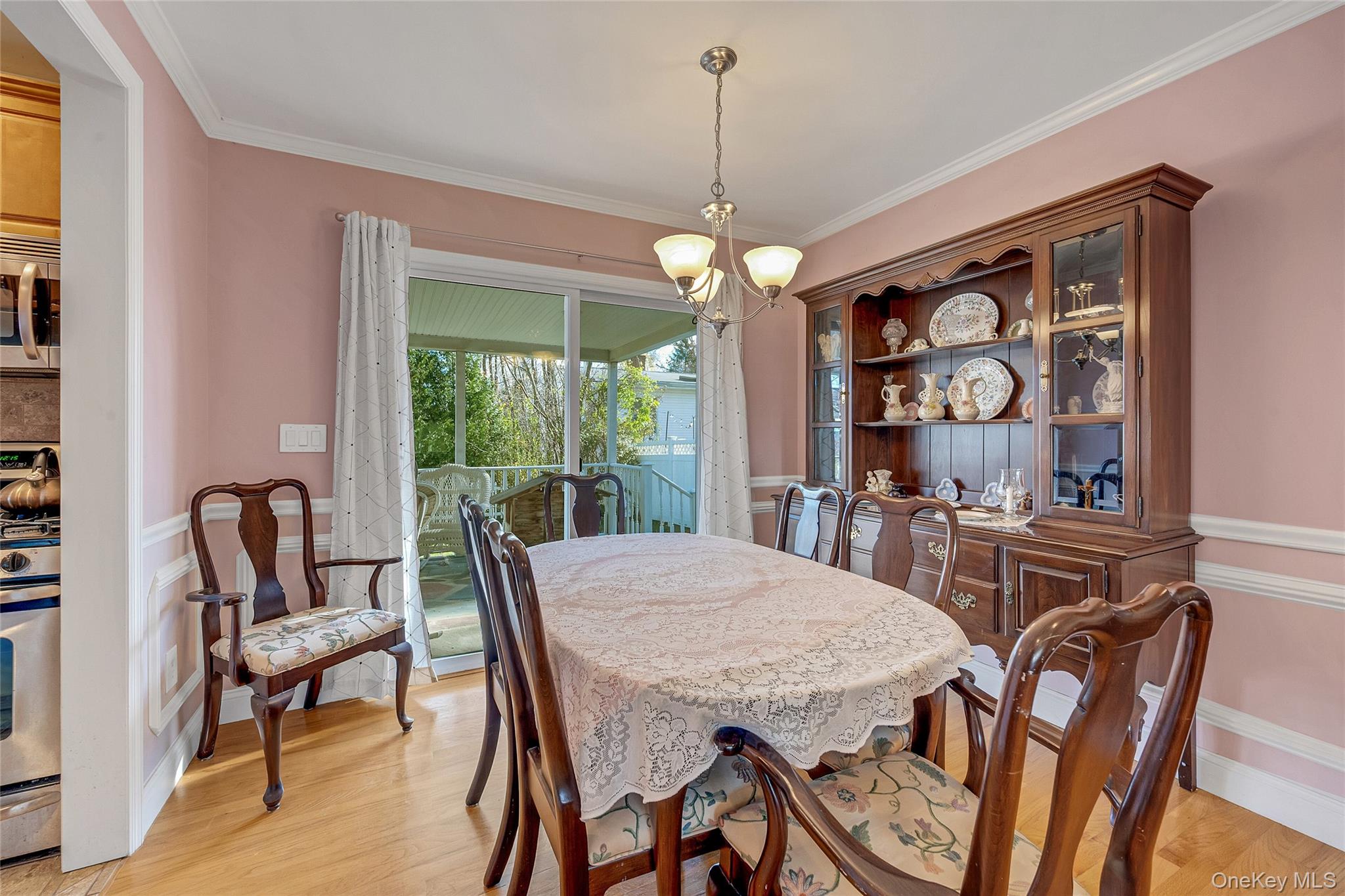 15 Andrew Road Eastchester, NY 10709 - Photo 13 of 22 a view of a dining room with furniture wooden floor and chandelier