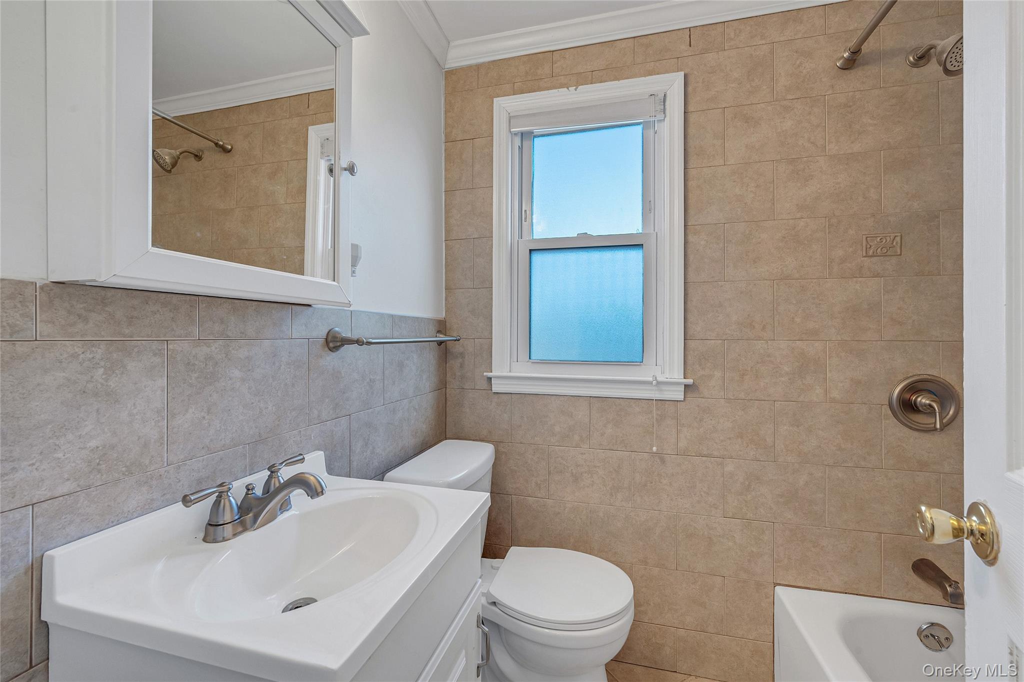 15 Andrew Road Eastchester, NY 10709 - Photo 16 of 22 a bathroom with a sink mirror and toilet