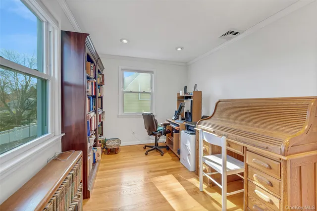 a bedroom with a bed and a dresser in it