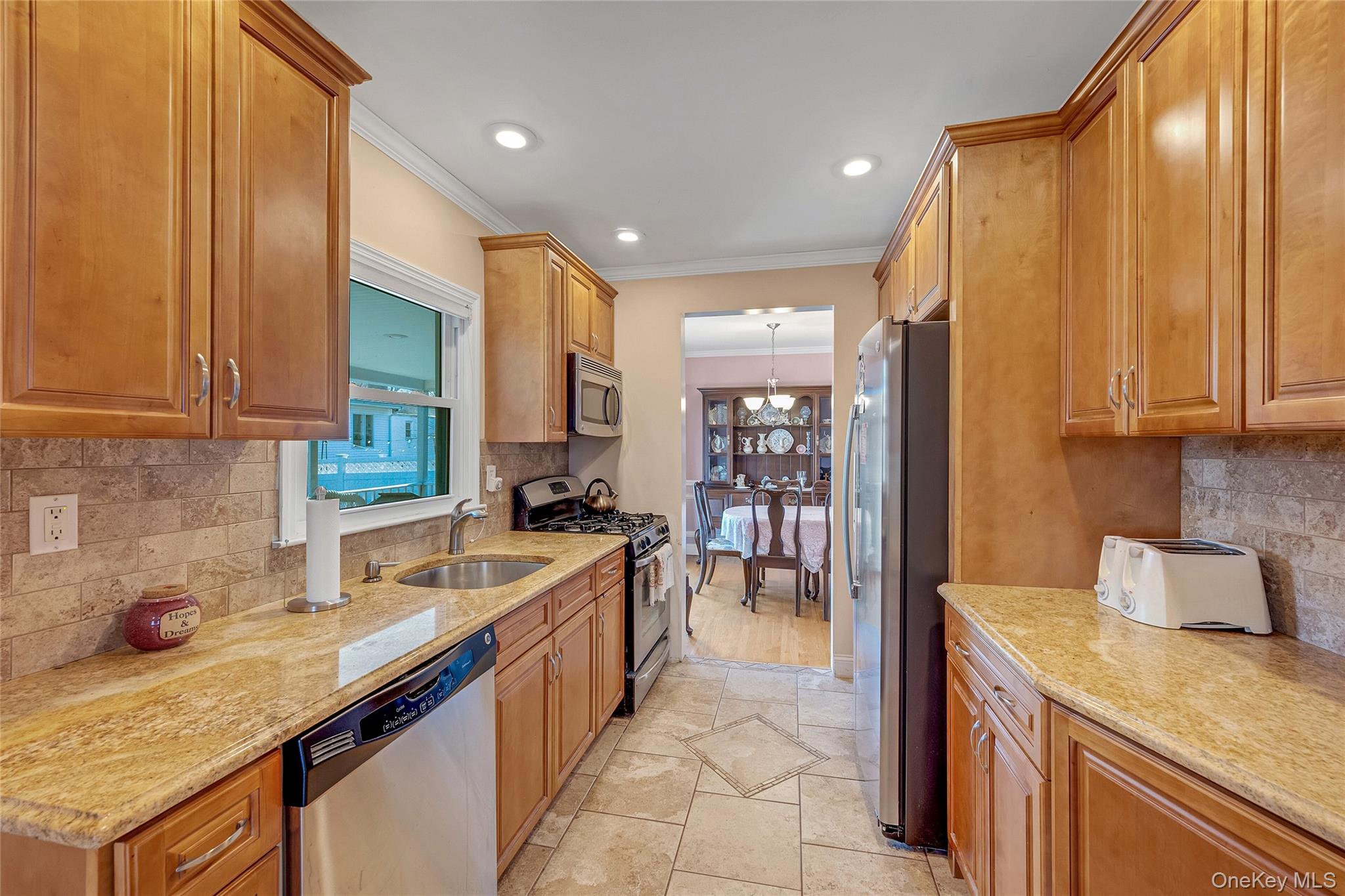 15 Andrew Road Eastchester, NY 10709 - Photo 6 of 22 a kitchen with a sink stove and cabinets