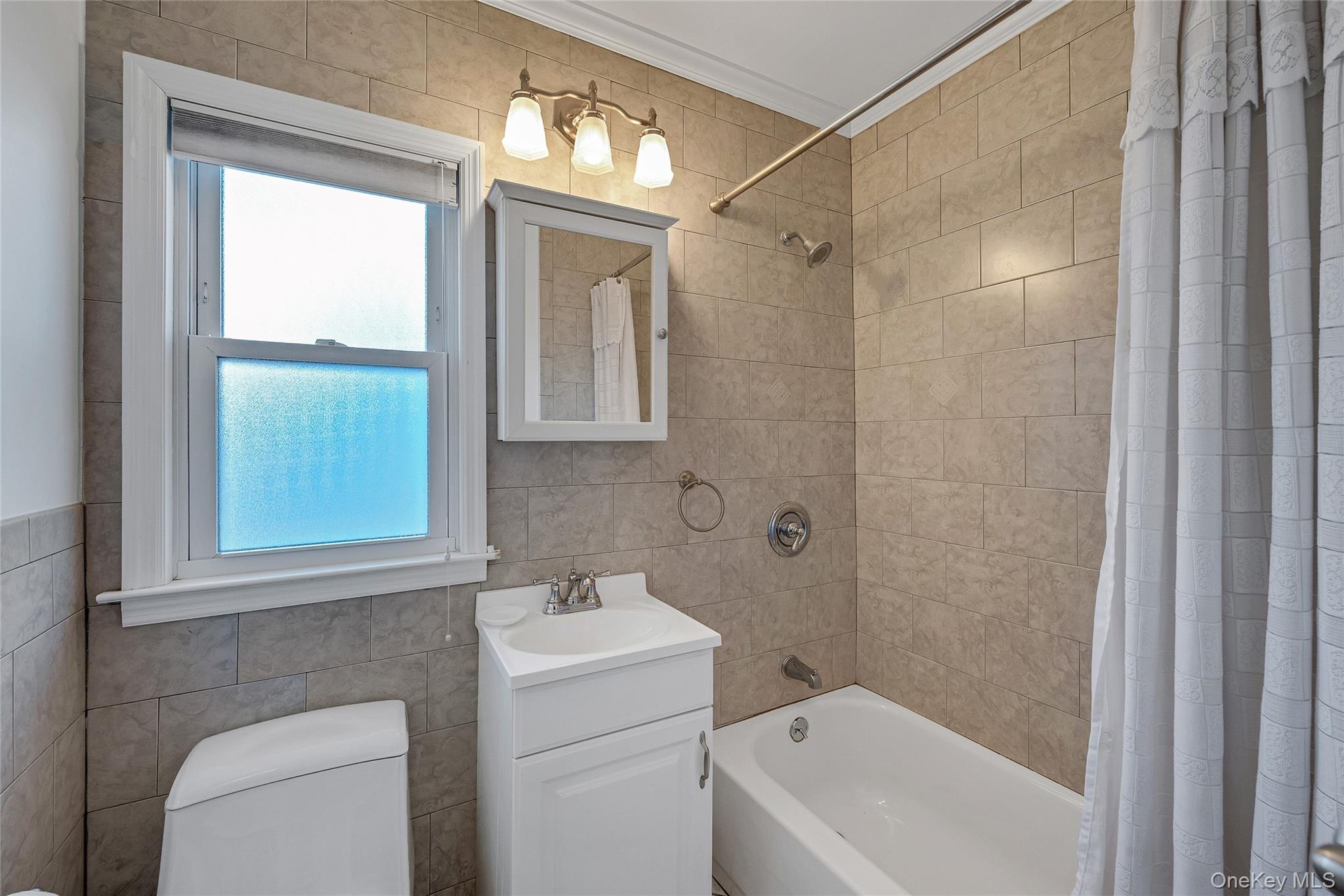 15 Andrew Road Eastchester, NY 10709 - Photo 8 of 22 a bathroom with a shower a sink and a toilet