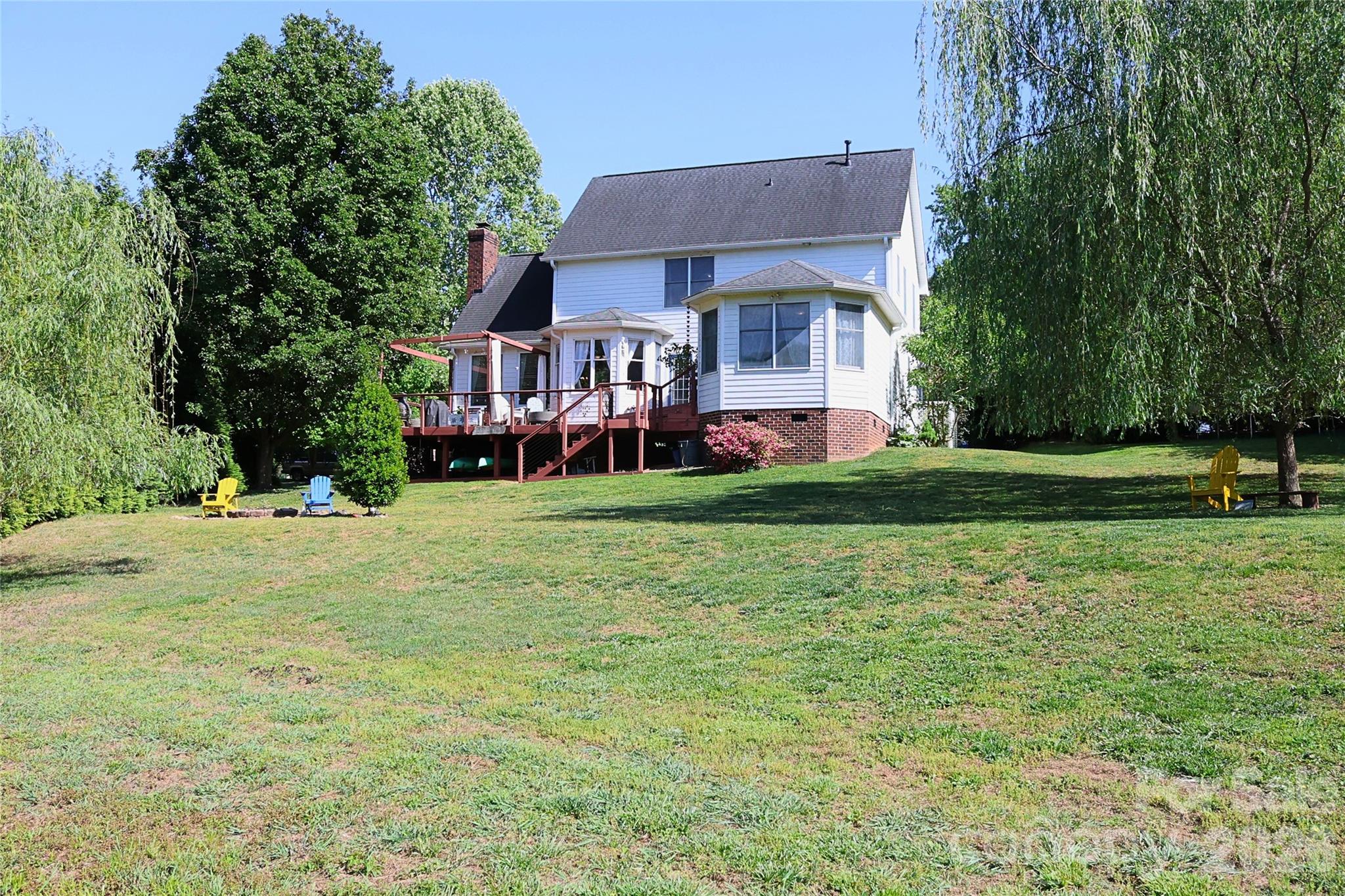 2325 Perry Road Denver, NC 28037 - Photo 23 of 28 a front view of a house with a yard