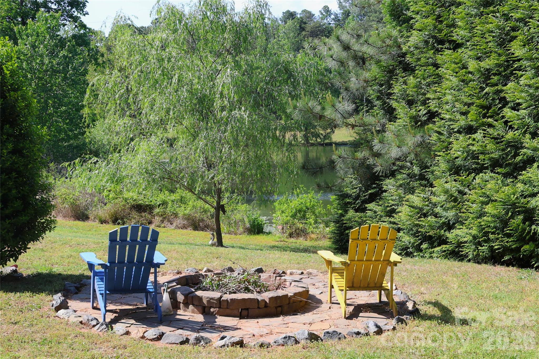 2325 Perry Road Denver, NC 28037 - Photo 24 of 28 a view of a chairs and fire pit in the yard