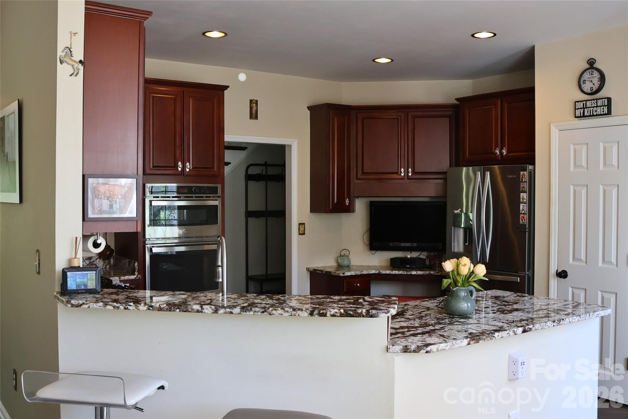 2325 Perry Road Denver, NC 28037 - Photo 5 of 28 a kitchen with stainless steel appliances granite countertop a refrigerator and a stove top oven