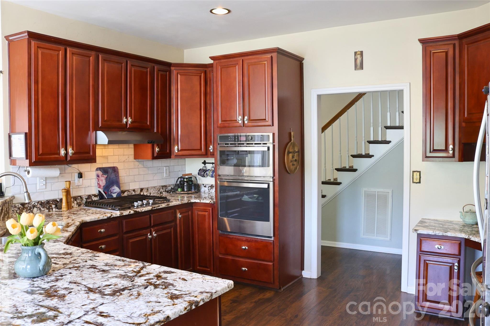 2325 Perry Road Denver, NC 28037 - Photo 6 of 28 a kitchen with stainless steel appliances granite countertop a refrigerator and a stove top oven