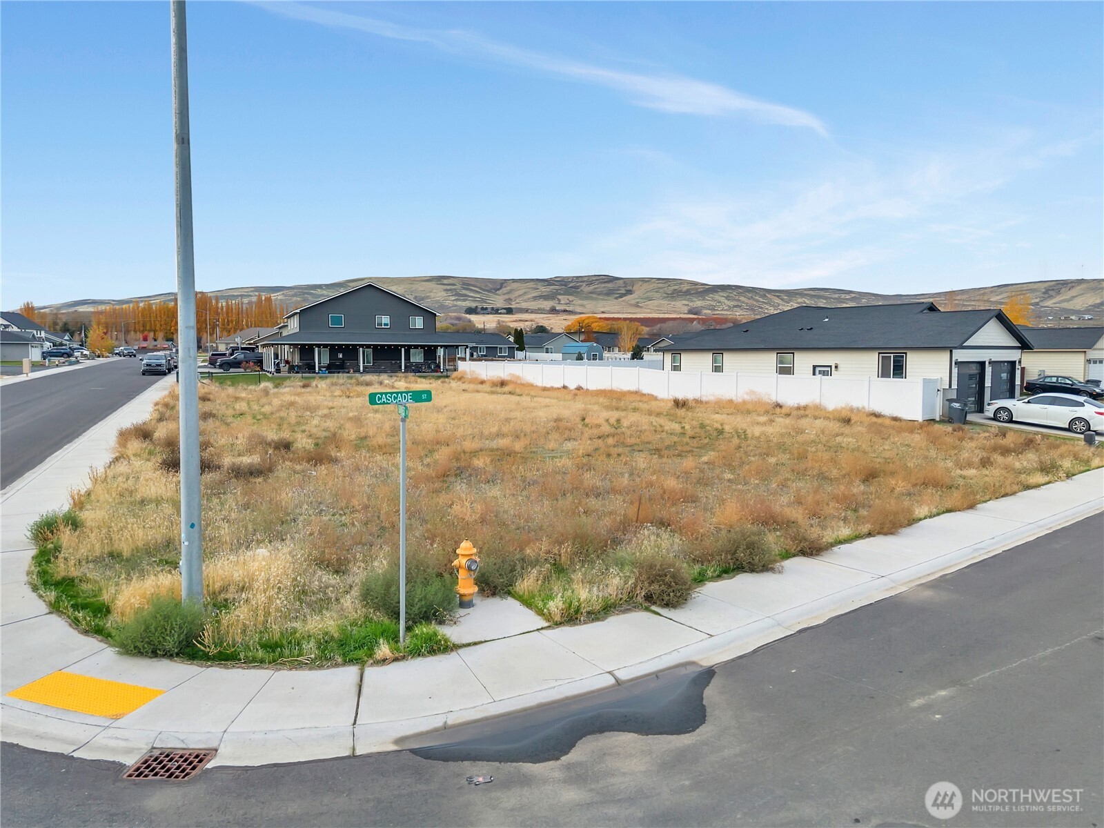 2399 Cascade Street Ephrata, WA 98823 - Photo 2 of 6 a view of a terrace with a garden and wooden fence