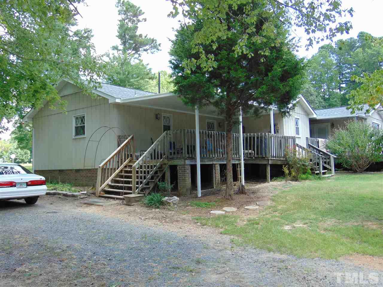 2068 Sanders Road Stem, NC 27581 - Photo 2 of 21 a view of a house with backyard and furniture