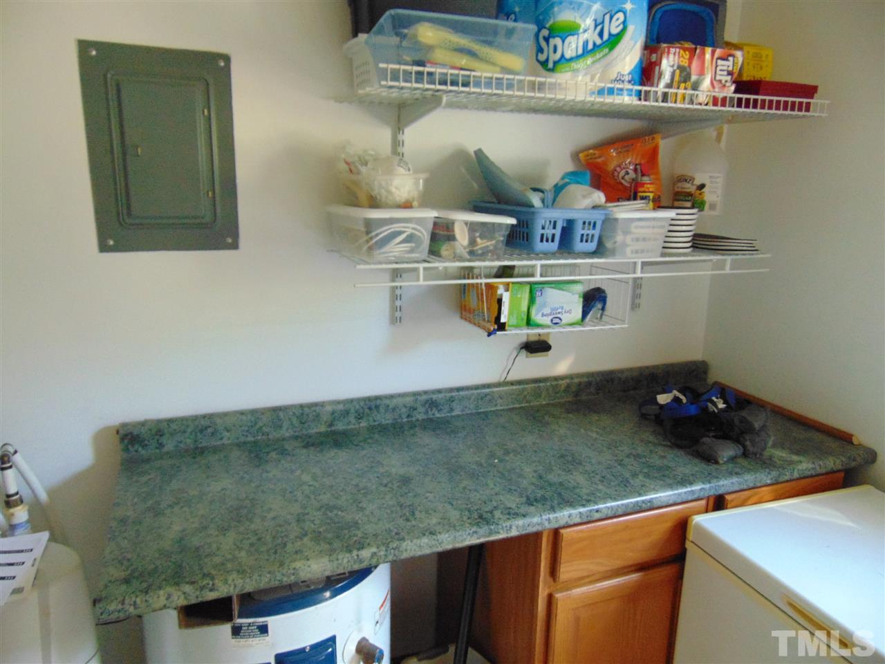 2068 Sanders Road Stem, NC 27581 - Photo 21 of 21 a kitchen with stainless steel appliances granite countertop a sink and cabinets