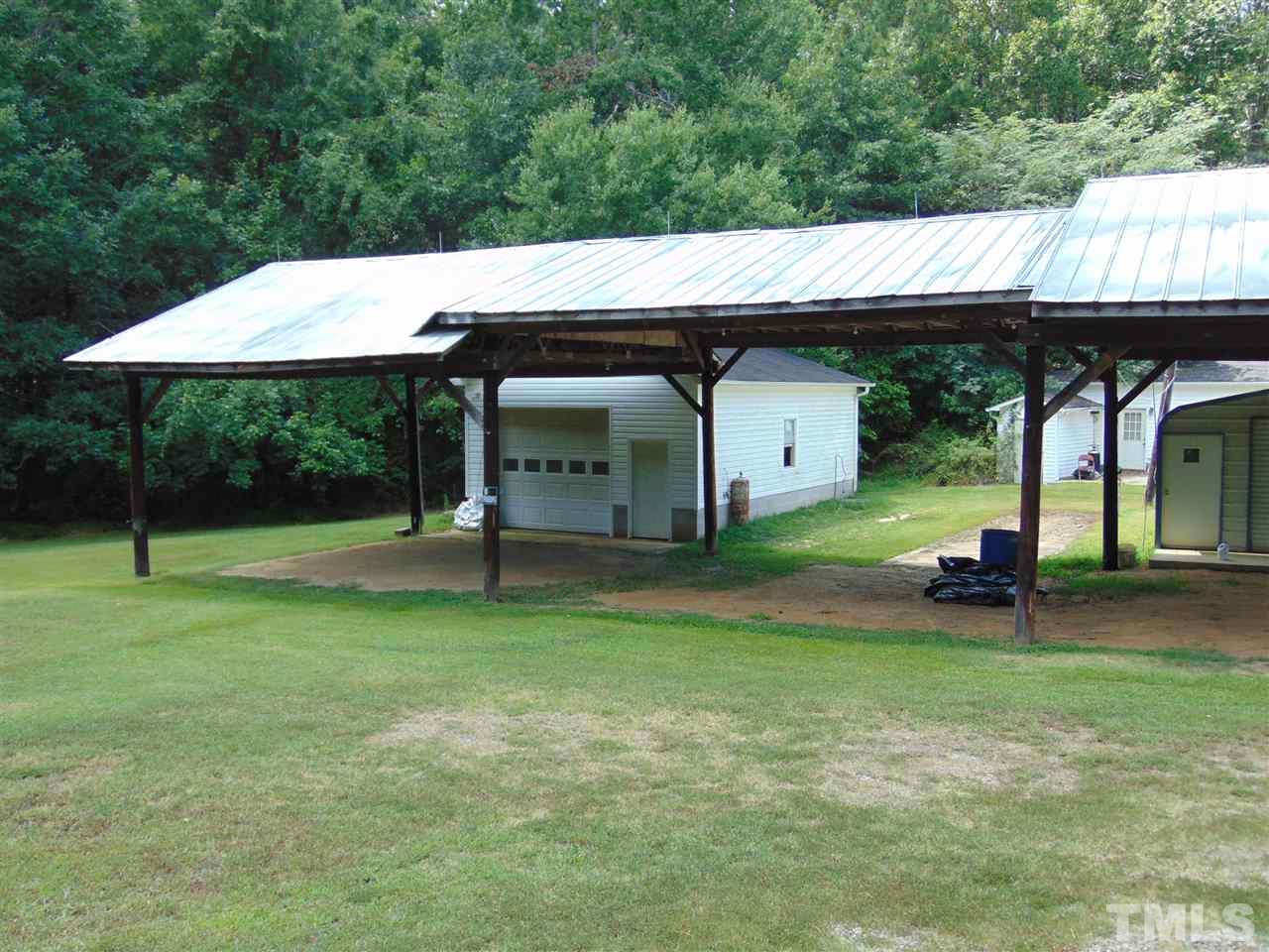 2068 Sanders Road Stem, NC 27581 - Photo 3 of 21 a backyard of a house with table and chairs