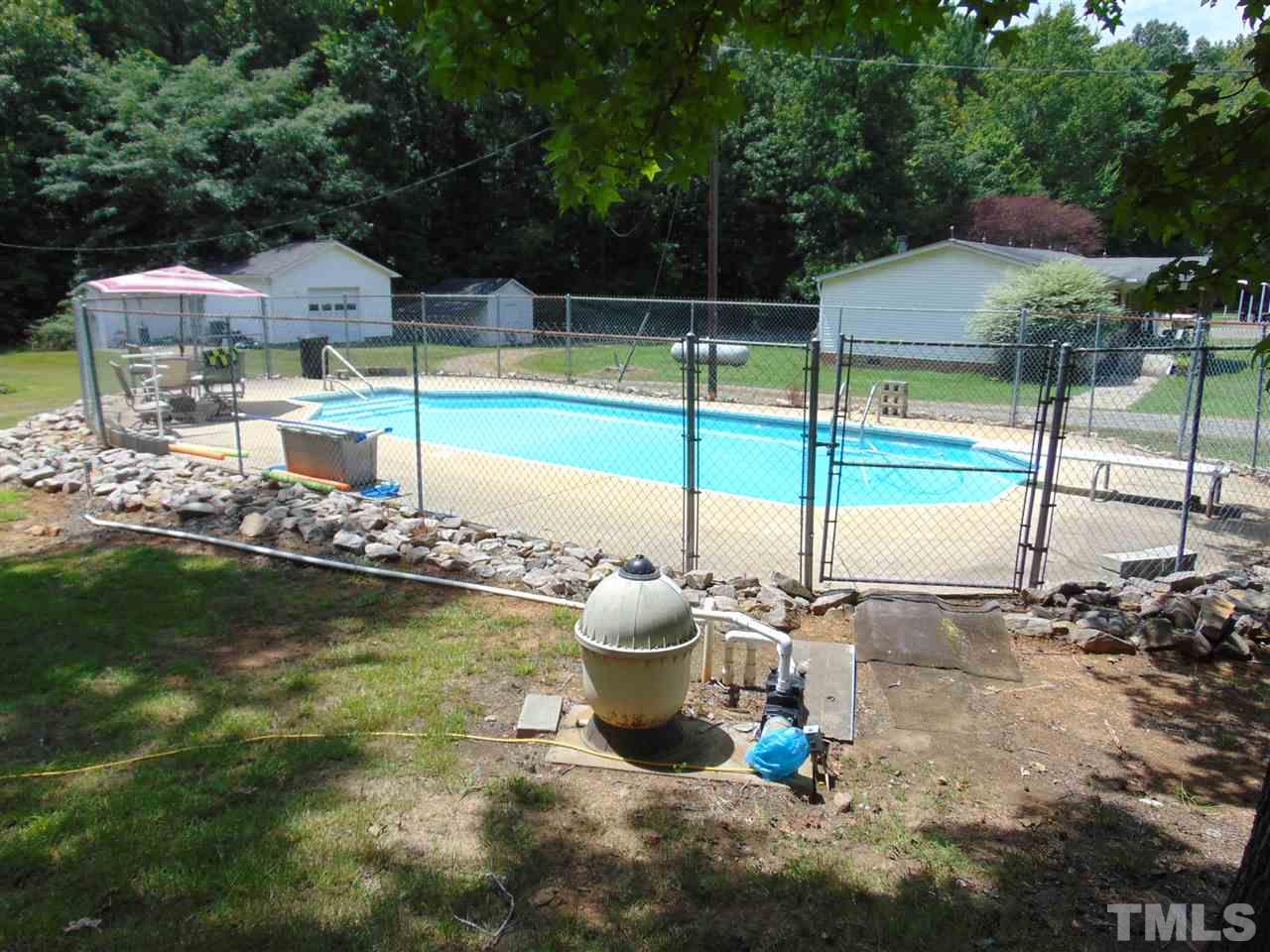 2068 Sanders Road Stem, NC 27581 - Photo 4 of 21 a swimming pool with yard view