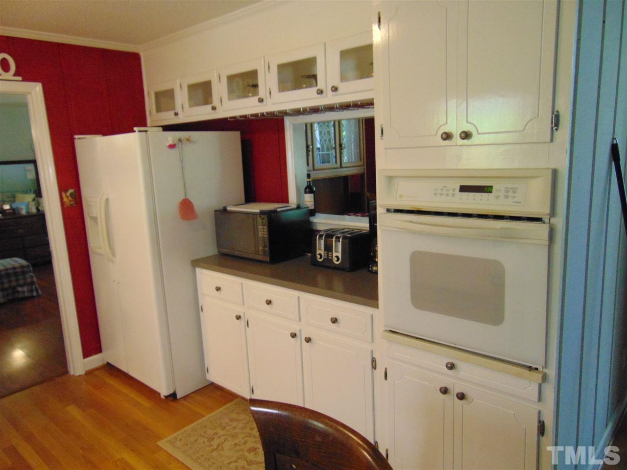 2068 Sanders Road Stem, NC 27581 - Photo 10 of 21 a kitchen with stainless steel appliances a refrigerator and a stove