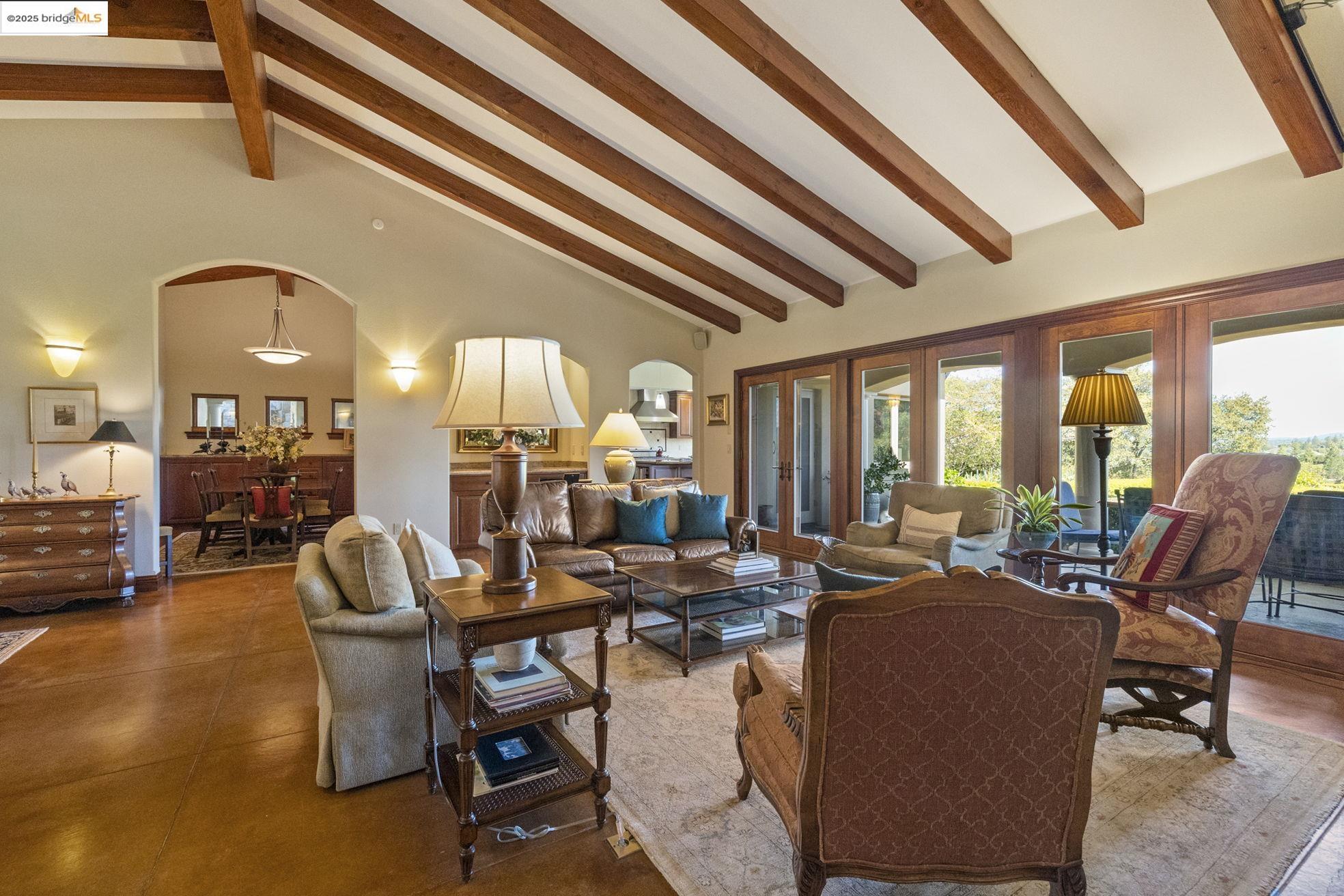 10270 Slate Rim Road Sonora, CA 95370 - Photo 11 of 55 a living room with furniture and a chandelier