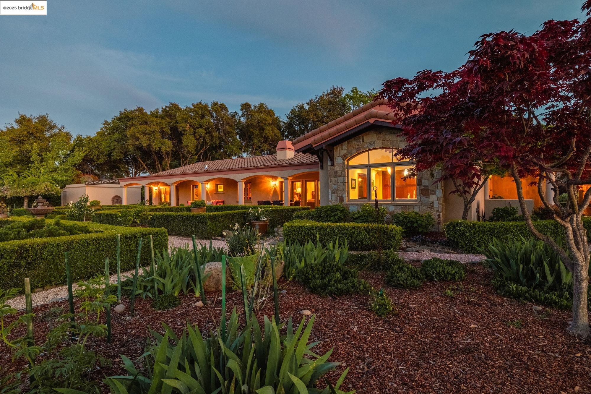 10270 Slate Rim Road Sonora, CA 95370 - Photo 26 of 55 a view of a swimming pool with a garden and plants