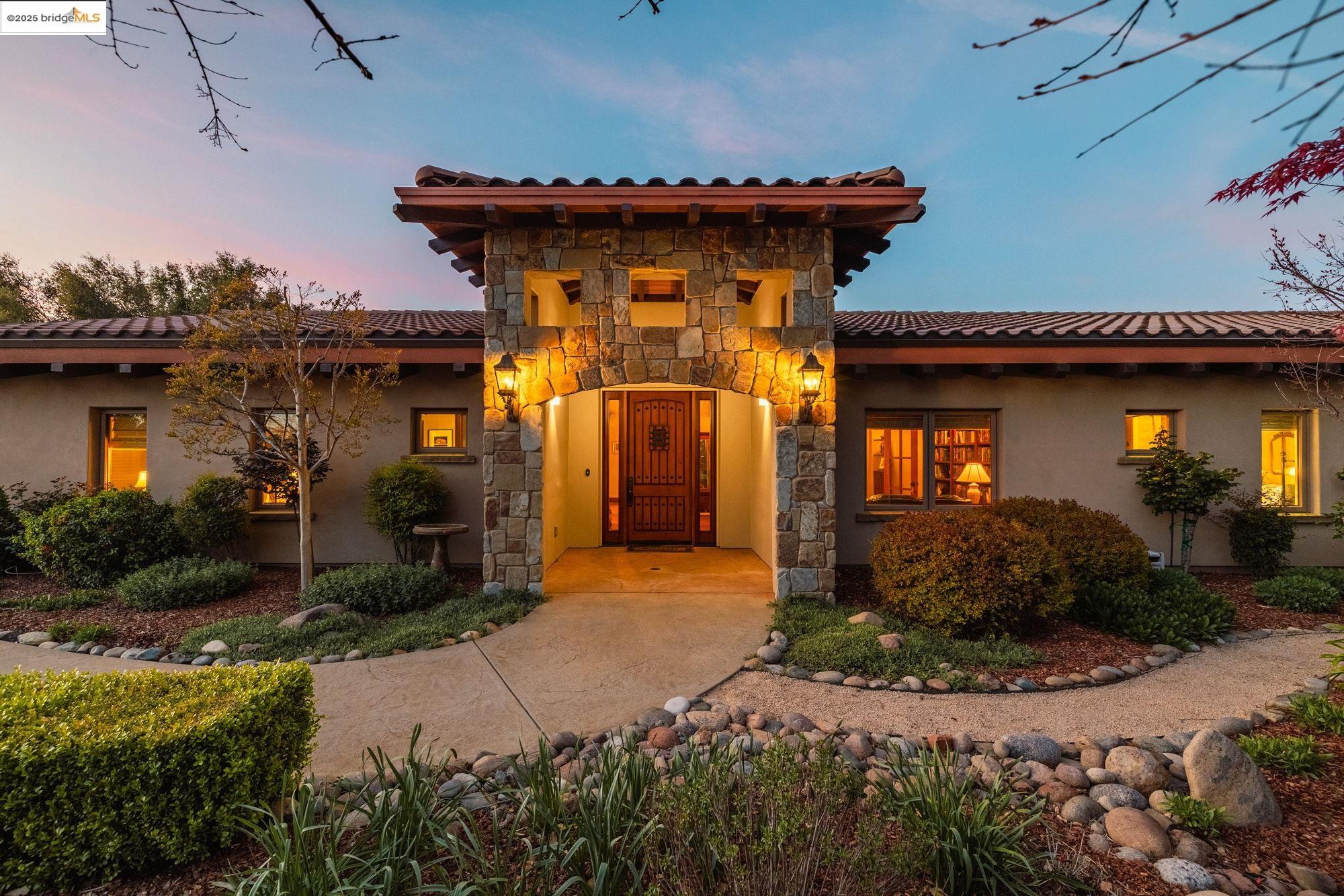 10270 Slate Rim Road Sonora, CA 95370 - Photo 29 of 55 a front view of a house with garden
