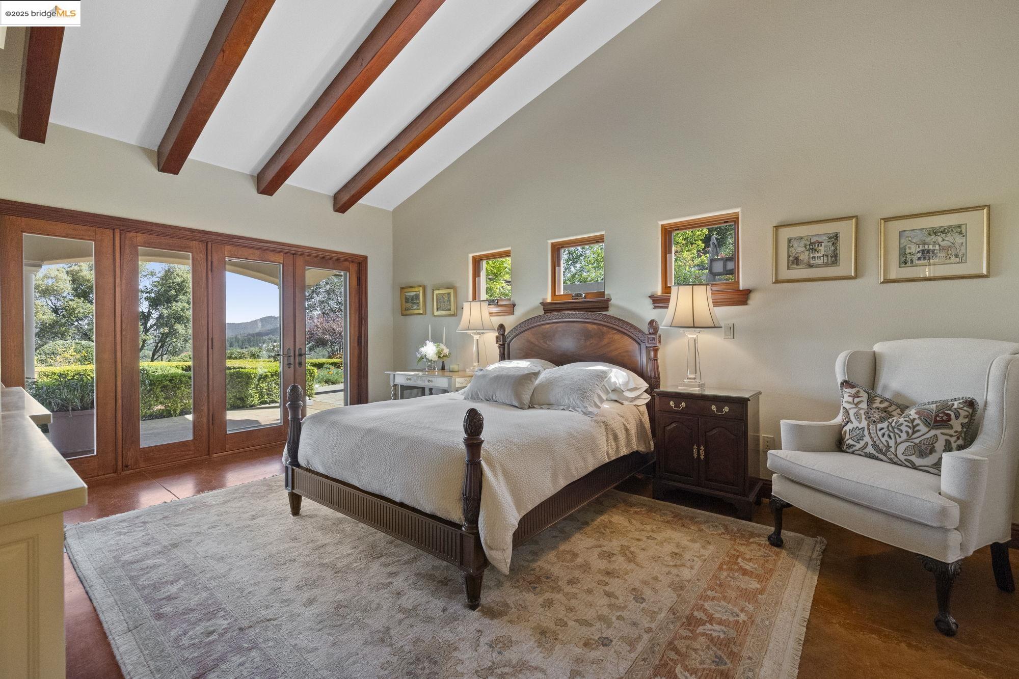 10270 Slate Rim Road Sonora, CA 95370 - Photo 34 of 55 a spacious bedroom with a bed and a couch