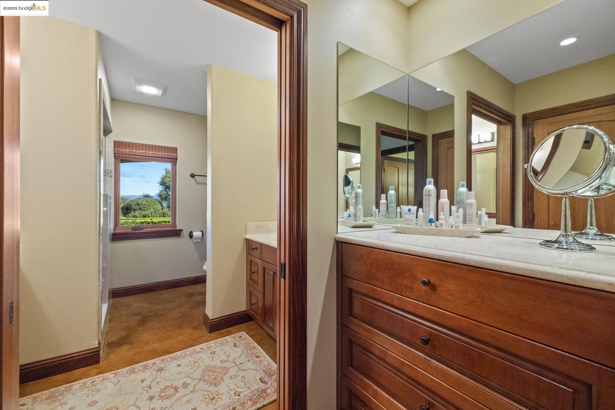 10270 Slate Rim Road Sonora, CA 95370 - Photo 39 of 55 a bathroom with a sink and a mirror