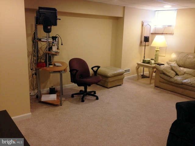 1011 Bayner Road Baltimore, MD 21221 - Photo 19 of 30 a view of a workspace with furniture and a window