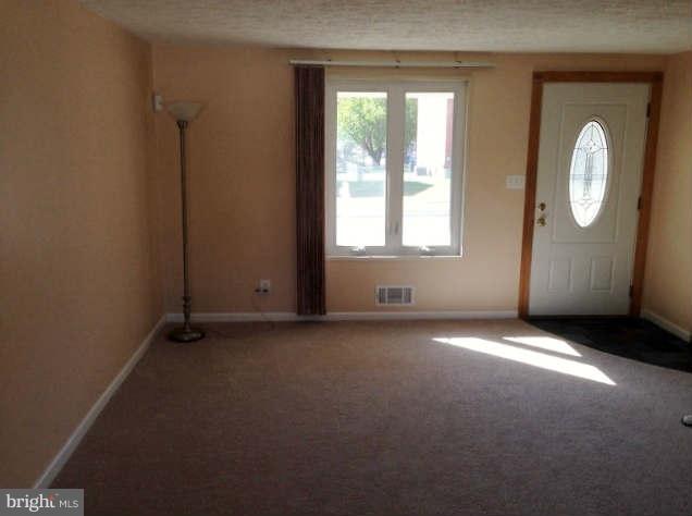 1011 Bayner Road Baltimore, MD 21221 - Photo 3 of 30 an empty room with windows