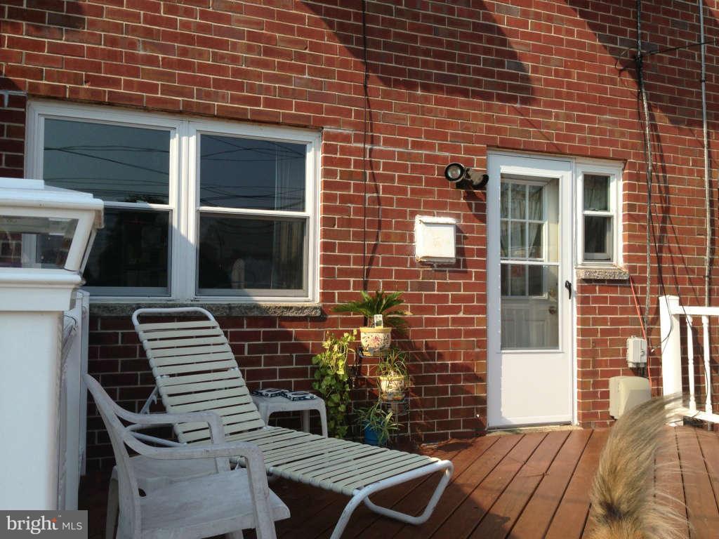 1011 Bayner Road Baltimore, MD 21221 - Photo 24 of 30 a front view of a house with a yard