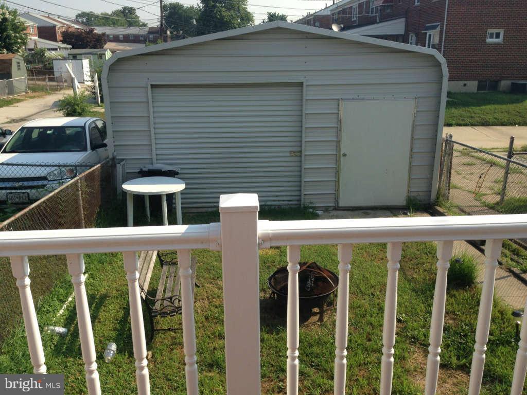 1011 Bayner Road Baltimore, MD 21221 - Photo 27 of 30 a view of a small yard and front view of a house