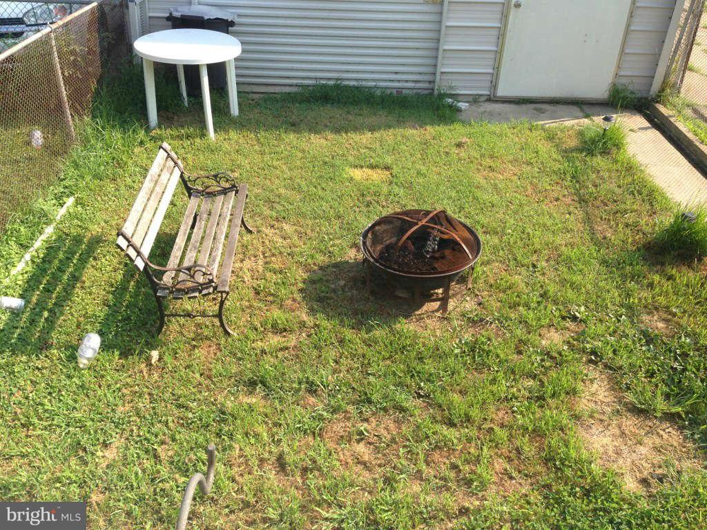 1011 Bayner Road Baltimore, MD 21221 - Photo 28 of 30 a view of a backyard with table and chairs