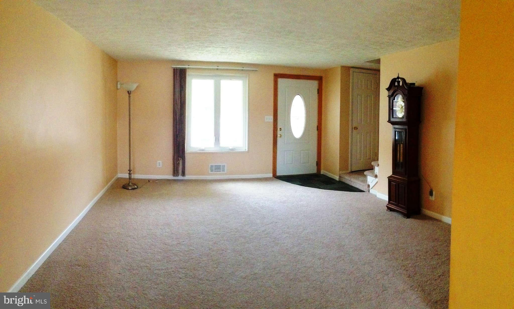 1011 Bayner Road Baltimore, MD 21221 - Photo 5 of 30 an empty room with windows