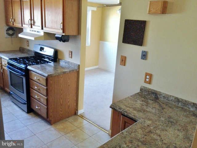 1011 Bayner Road Baltimore, MD 21221 - Photo 10 of 30 a kitchen with stainless steel appliances granite countertop a stove and a sink