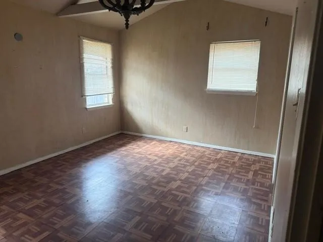 an empty room with windows