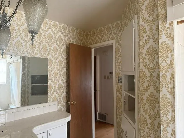 a bathroom with a tub and shower