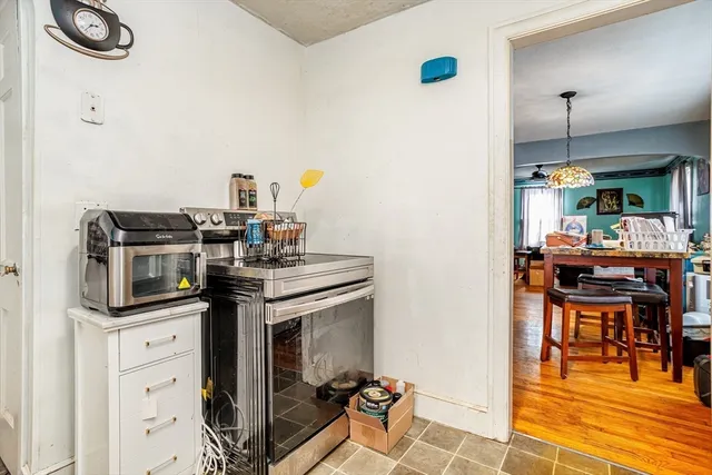 a kitchen with stainless steel appliances granite countertop a stove and a sink