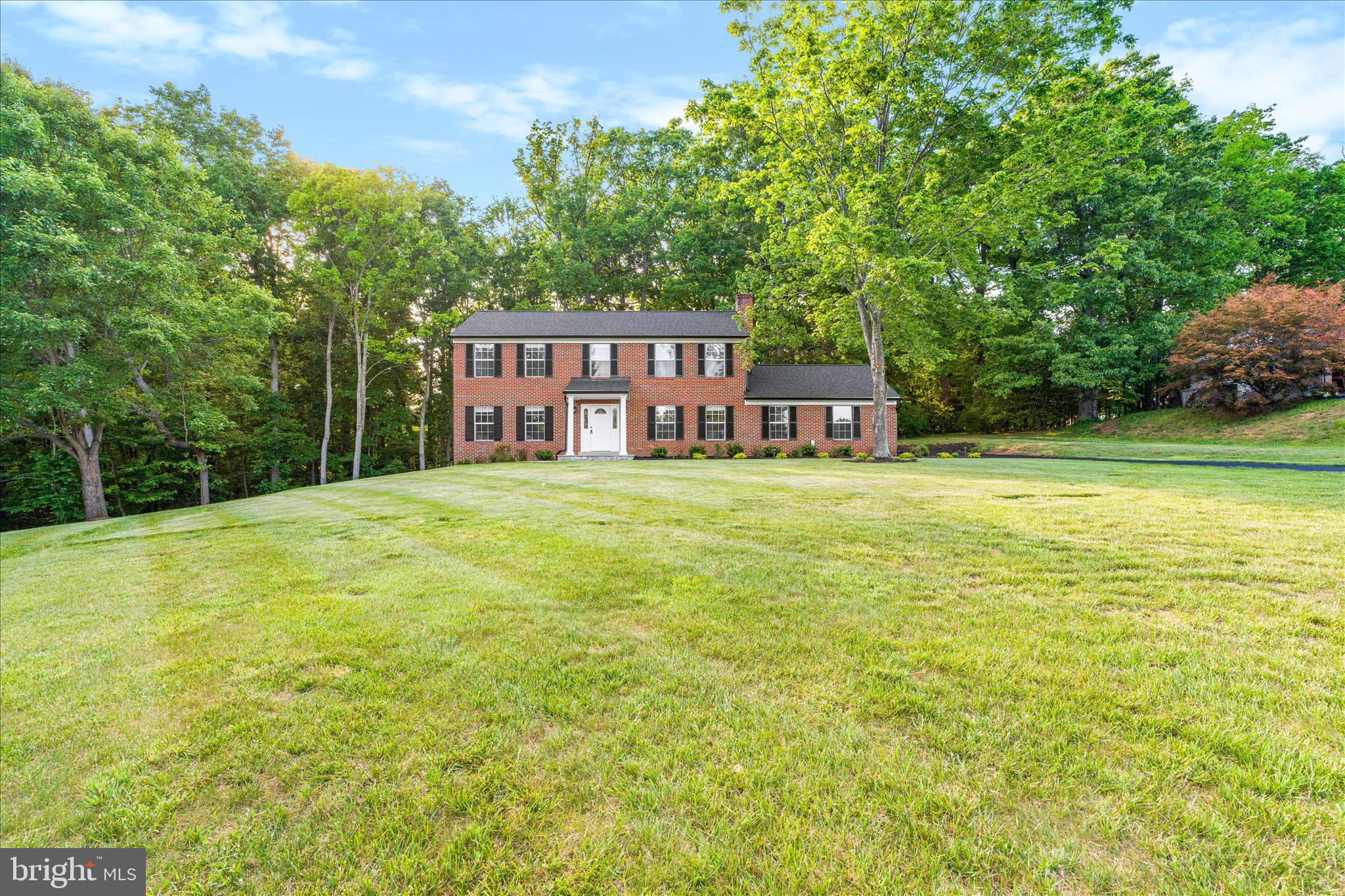 3908 Shakespeare Way Monrovia, MD 21770 - Photo 2 of 59 a view of a house with a big yard and large trees
